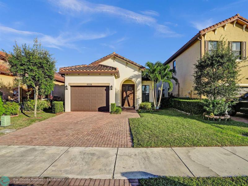 First Photo for Home For Sale at 5006 NW 48th Ln Tamarac, FL. 33319