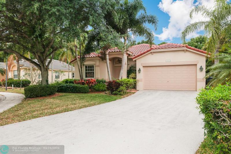 First Photo for Home For Sale at 6011 NW Swans Way Coconut Creek, FL. 33073