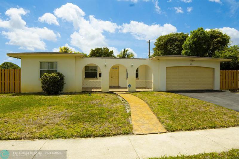 First Photo for Home For Sale at 3470 NW 29th St Lauderdale Lakes, FL. 33311