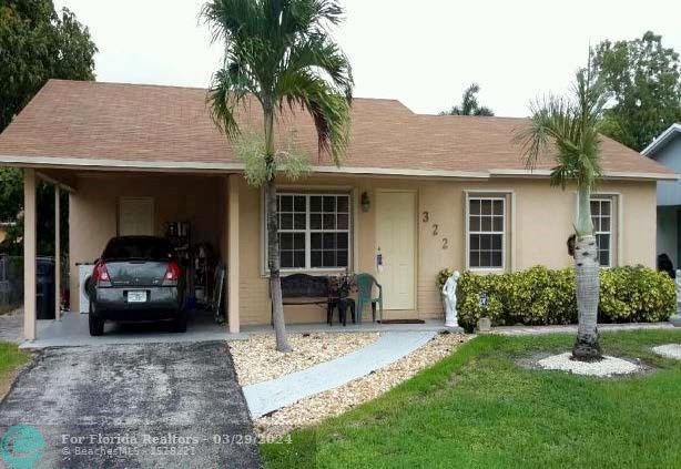 First Photo for Home For Sale at 322 SW 79TH AV North Lauderdale, FL. 33068