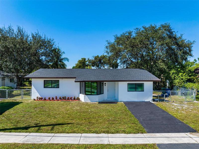 First Photo for Home For Sale at 1521 NW 55th Ave Lauderhill, FL. 33313