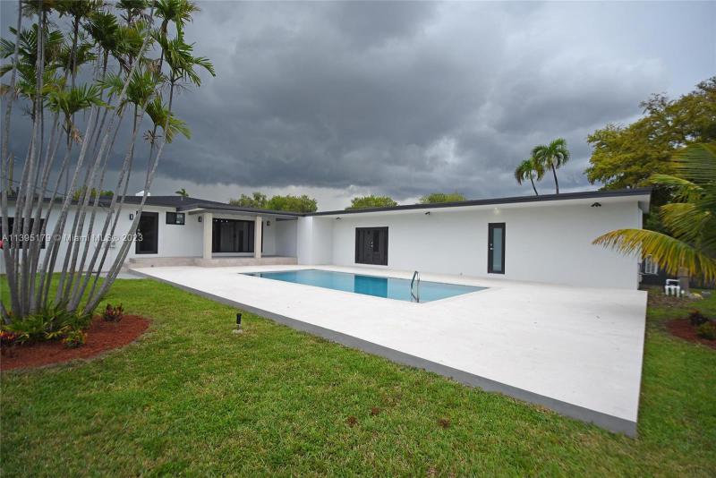 First Photo for Home For Sale at 1230 N Royal Poinciana Blvd Miami Springs, FL. 33166