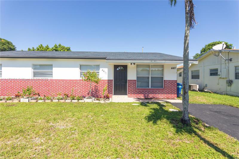 First Photo for Home For Sale at 4411 NW 61st St North Lauderdale, FL. 33319