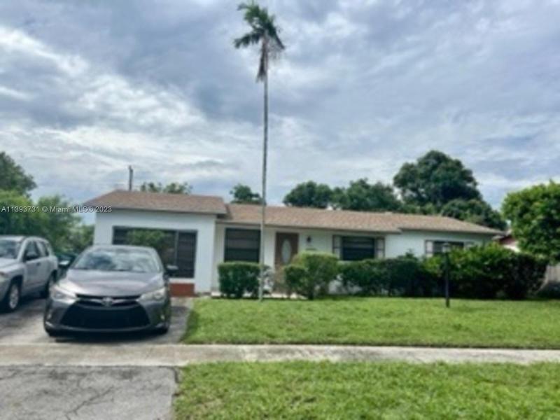 First Photo for Home For Sale at 4941 NW 17th St Lauderhill, FL. 33313