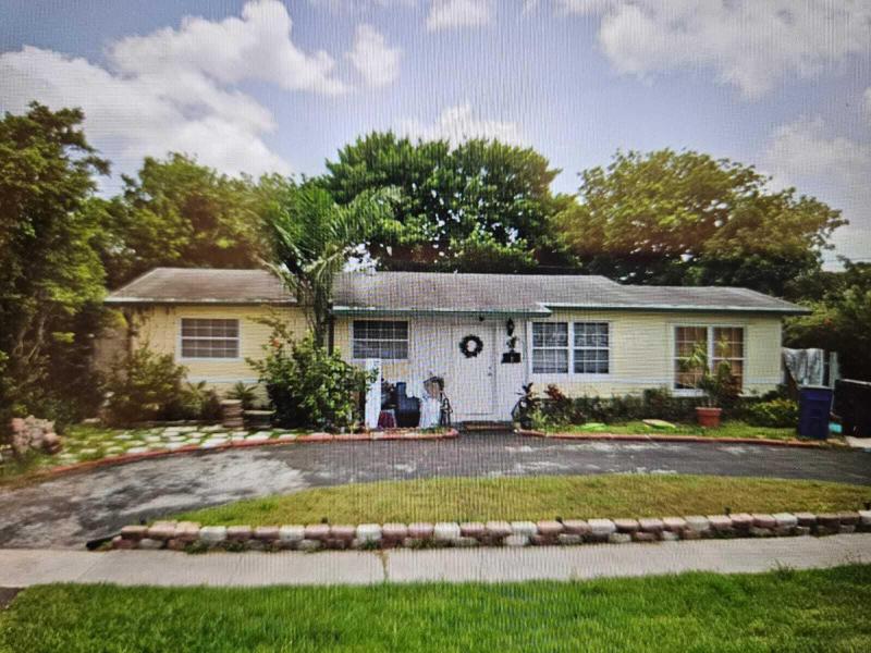 First Photo for Home For Sale at 4420 NW 34th Lauderdale Lakes, FL. 33319